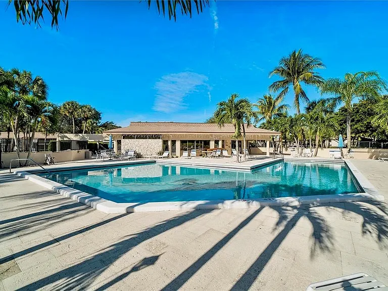 large heated community pool right next to condo
