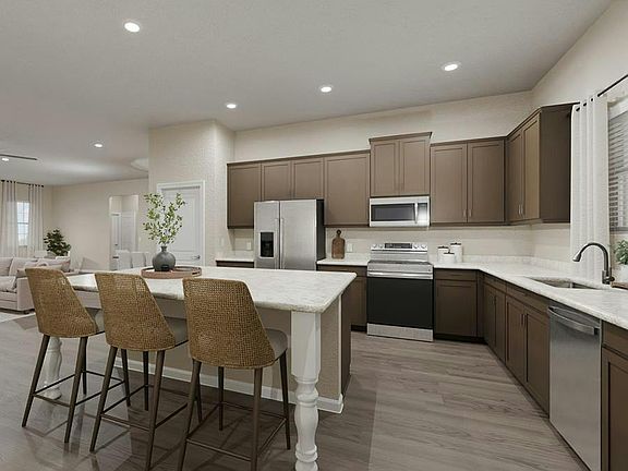 Your new kitchen includes ample cabinet and counter space, a counter-height island, and beautiful fi