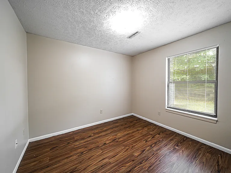 Bedrooms with solid plank flooring