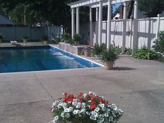 pool with retractable cover, heat, & waterfall  