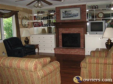 Family room with wood floors and custom storage