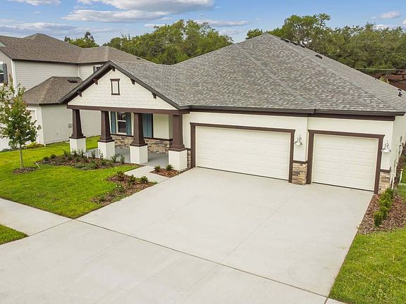 Sweet Bay new construction quick move-in craftsman elevation front right angled view at 8859 Mugnai