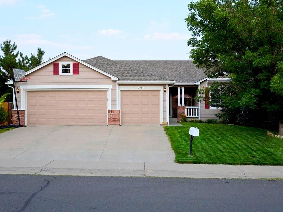Exterior Front with 3 Car Garage and Nice Lawn