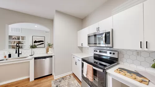 Newly Renovated Kitchen with Stainless Steel Appliances - Deep Deuce at Bricktown Apartments