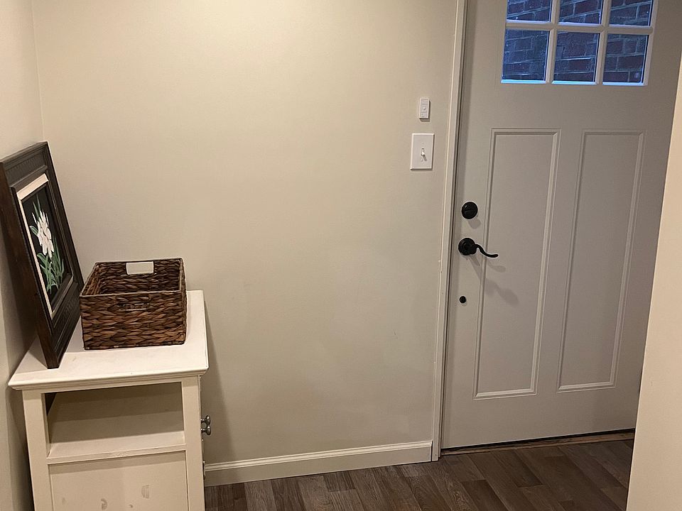 Inside the entrance is a room that may be used as a den, office, or perhaps a playroom.