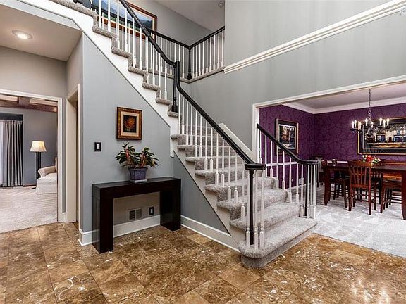 Beautiful entry with marble floors and new carpeting throughout