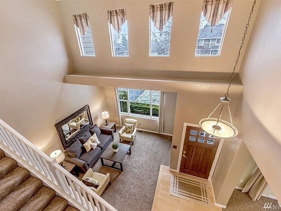 Enter into this Stunning Entry with Vaulted Ceilings, Formal Living & Dining 
