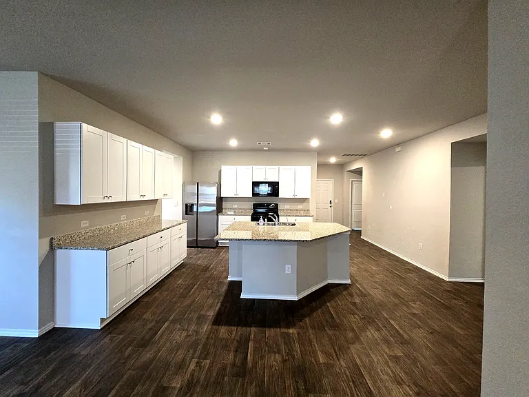 Open-concept kitchen with modern finishes and plenty of cabinet space.