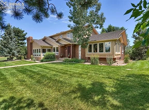 Brick & stucco exterior with new roof and new Pella vinyl windows in the living, dining, family & flex room.