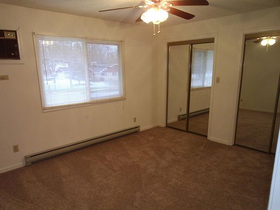 Master bedroom with large mirror closets