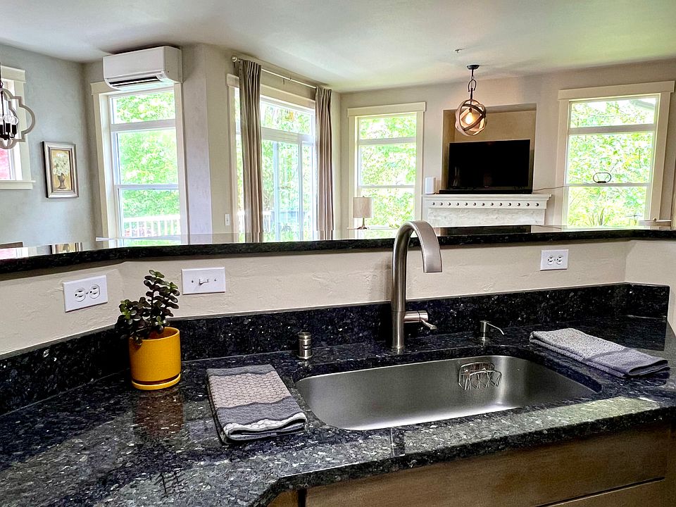 Kitchen sink area looking into the living room