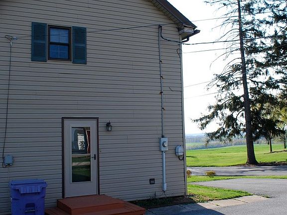 View of entry door from driveway. (Trash is paid by tenant directly to Township)