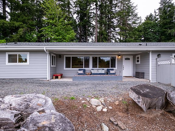 The front of the home features new siding, a fresh roof, modern gutters, and updated windows and doors.