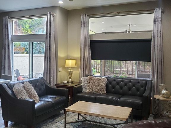 Family room, giant ceiling fan with roll-way blind