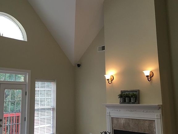 Great room with cathedral ceiling and fireplace