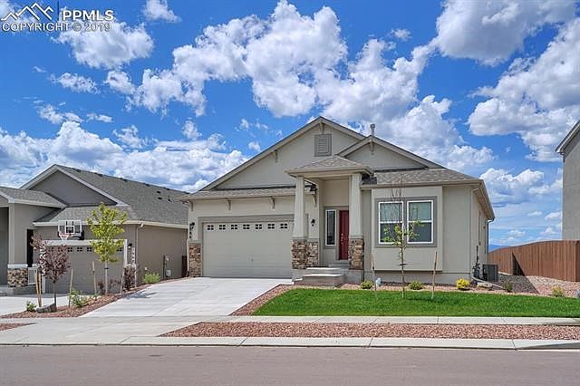 One Year New, like a model home, over 3,400 sq ft Beautiful 4/5 Bedroom Ranch Home backing onto Sand Creek w/gorgeous Pikes Peak Views.