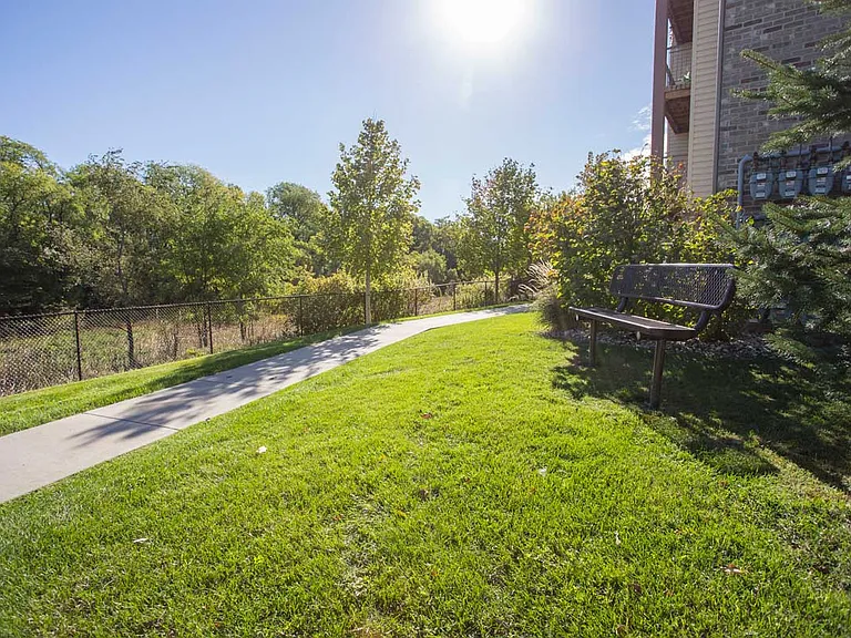 Relax on a bench overlooking Zorinsky Park, just steps outside your door.
