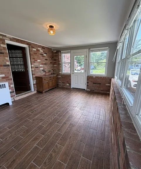 Sun filled Enclosed sunroom.