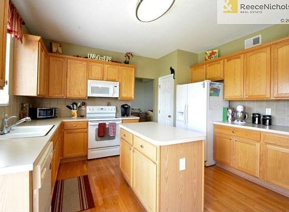 Loads of cabinets, custom pull-out shelving, island and pantry!