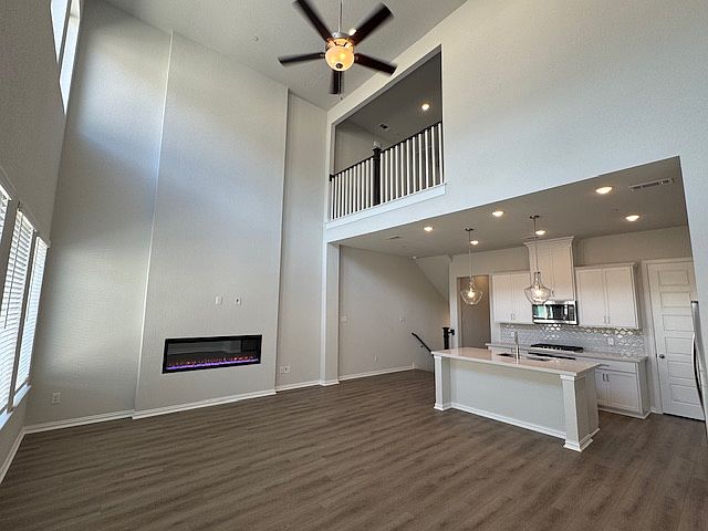 Open kitchen and living area on second floor.