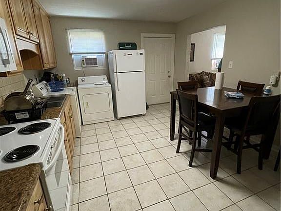 Full Kitchen with eating area.. Washer and Dryer convey