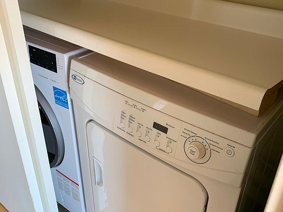 Utility closet with separate washer and dryer