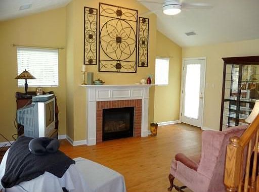 Living Room with vaulted ceiling and patio door.