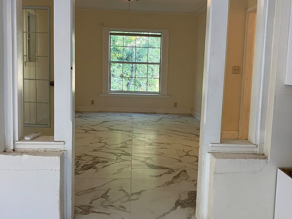 Newly tiled living room looking from the dining room