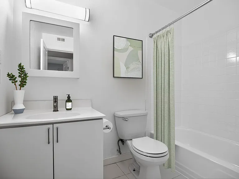 Elevate your living experience at The Woods at Ambler, an Eagle Rock Community. This beautifully designed bathroom features modern fixtures and a clean aesthetic, perfect for your daily routine. Schedule a tour today!