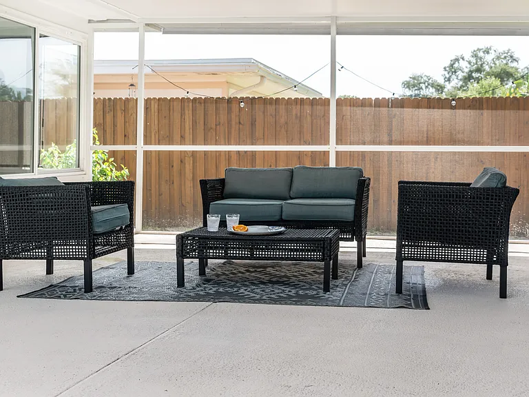 Outdoor screened-in seating area.