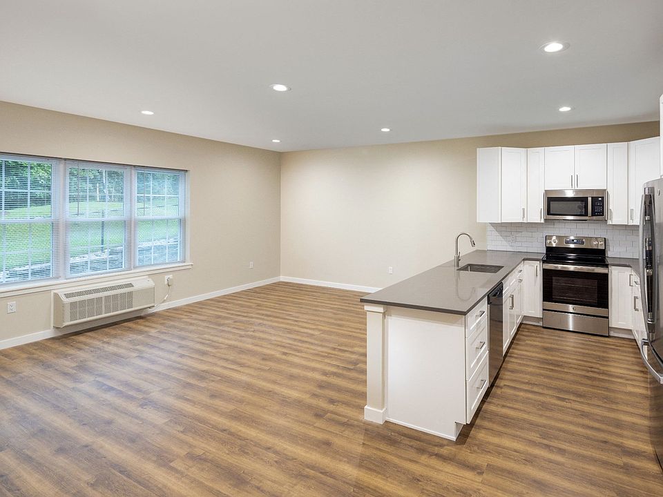 Townhouse Kitchen with Gray Counters and Dining Area