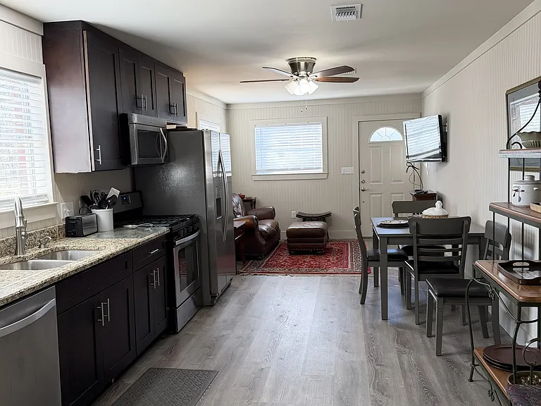 Kitchen opens to a breakfast and den area.