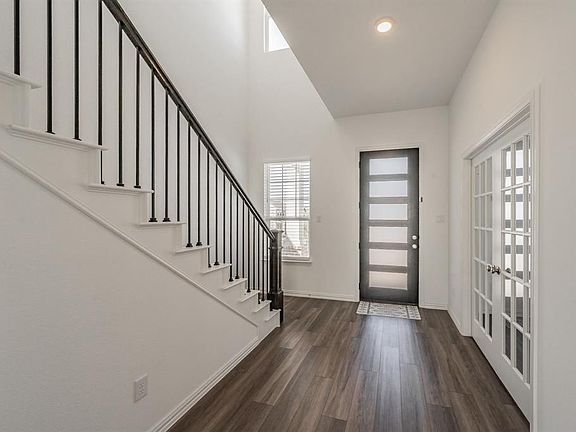 Soaring ceilings greet you at the door