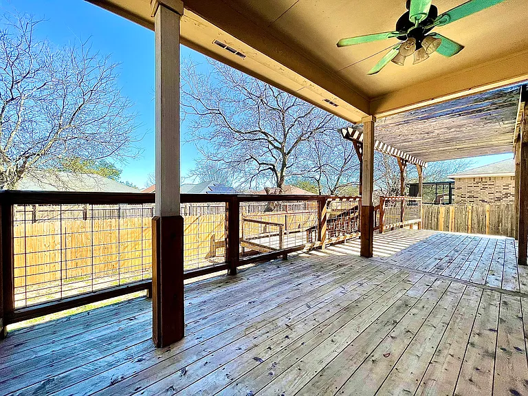 Backyard comes with two large wooden decks and a pergola patio
