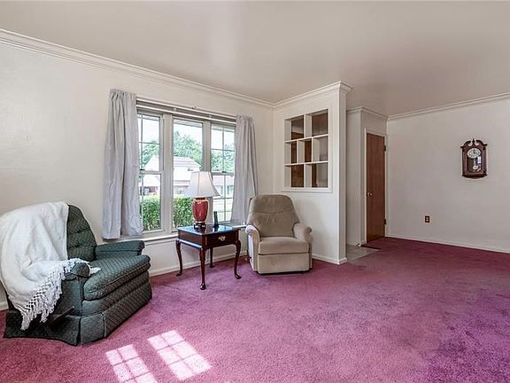 Large picture windows flood the space with natural light.