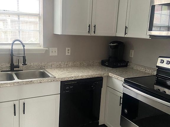 Updated kitchen appliances including a new refrigerator