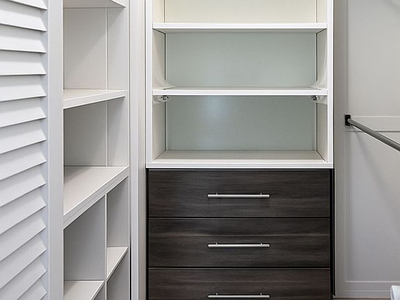 remodeled walk in closet of bedroom.