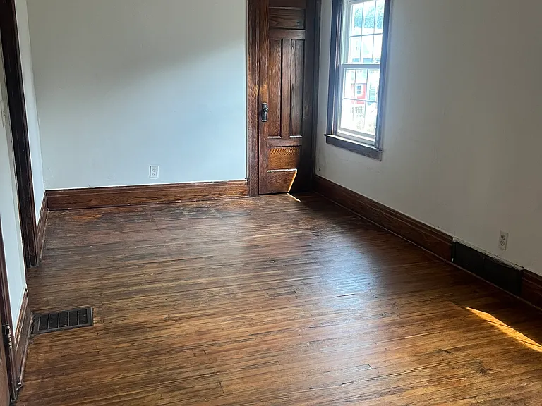 Large front room with refinished hardwood floors