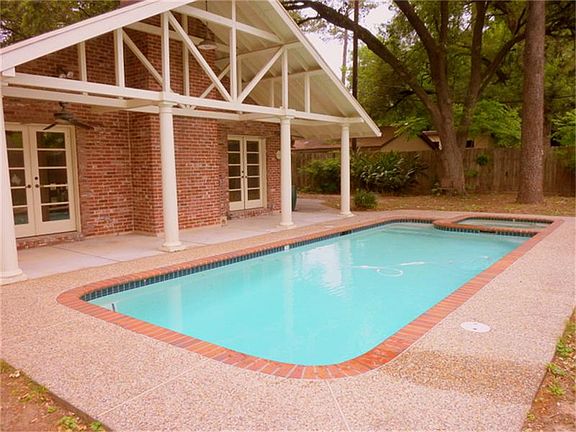 This pool and spa will be a summer time treat. Note the covered rear porch traverses the entire back