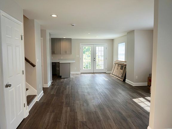 Open floorplan from family room to kitchen.