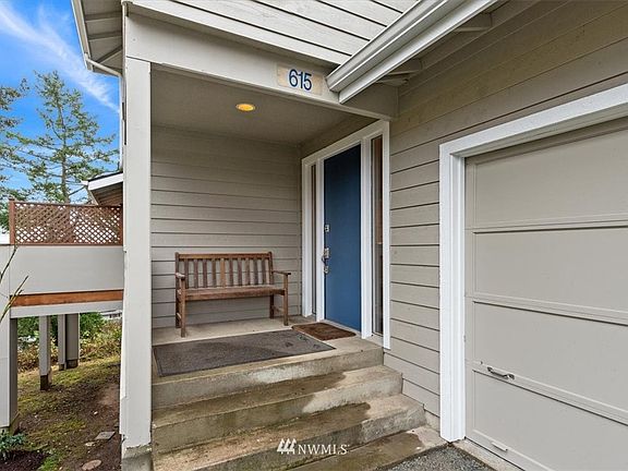 Main level landing under covered porch. 
