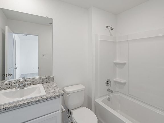 Master bathroom with a shower tub combination