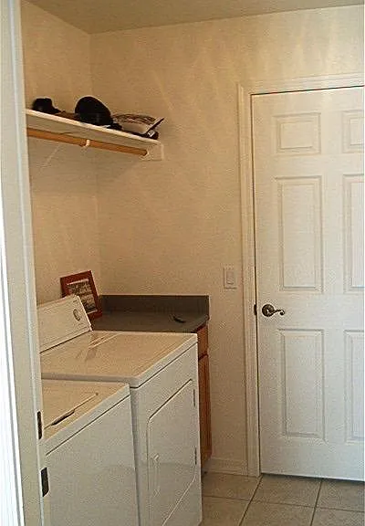 utility room with oak cabinet