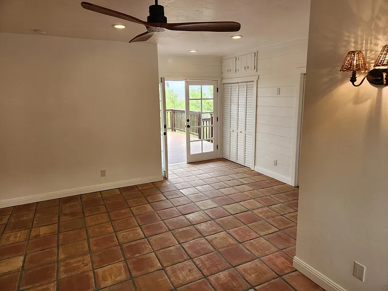 Modern ceiling fan keeps fresh air moving in studio.