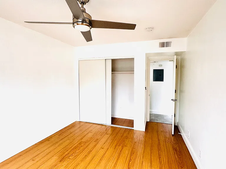 Spacious second bedroom with great natural light, ample closet space, and plenty of room for a queen-sized bed, desk, or additional furniture. Perfect for a guest room, home office, or roommate setup.