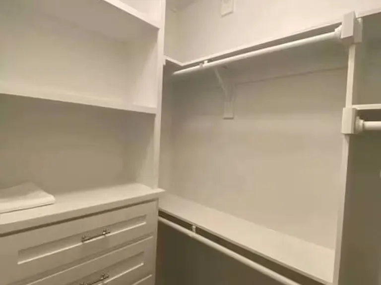 Enjoy a spacious walk-in closet featuring a 5-drawer dresser and ample storage space to store your belongings comfortably.