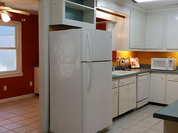 Kitchen opens to sunroom/dining area