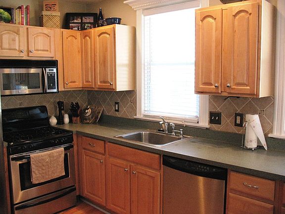 Second Kitchen View of Newer Maple Cabinets and Tile Backsplash