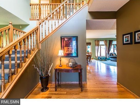 Spacious 2 story foyer welcomes the morning sun as well as friends and family.