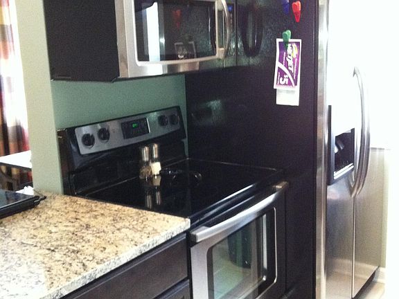 Convenient vented microwave over smooth top range (fridge is